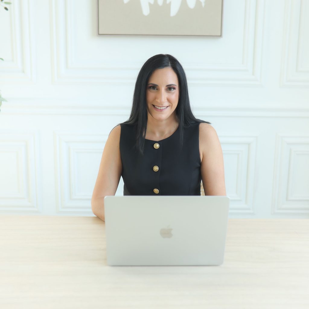 EleonoraCino_TranquilloSolutions_WhatWeOffer Eleonora Cino, Founder of Tranquillo Solutions working at a desk